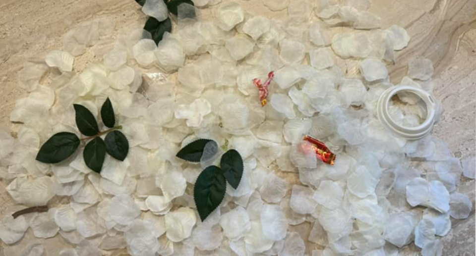 The synthetic flowers that were left behind after an apparent Valentine's Day proposal at Manly Beach. 