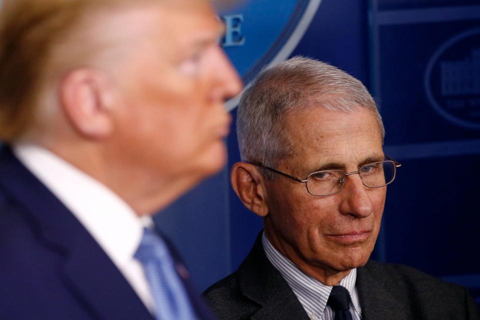 Director of the National Institute of Allergy and Infectious Diseases Dr. Anthony Fauci, right, and President Donald Trump listen as Vice President Mike Pence speaks during a coronavirus task force briefing at the White House, March 21, 2020, in Washington.