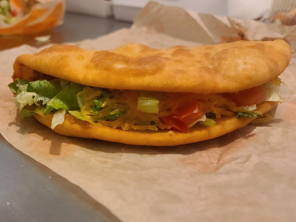 chalupa supreme from taco bell resting on its wrapper