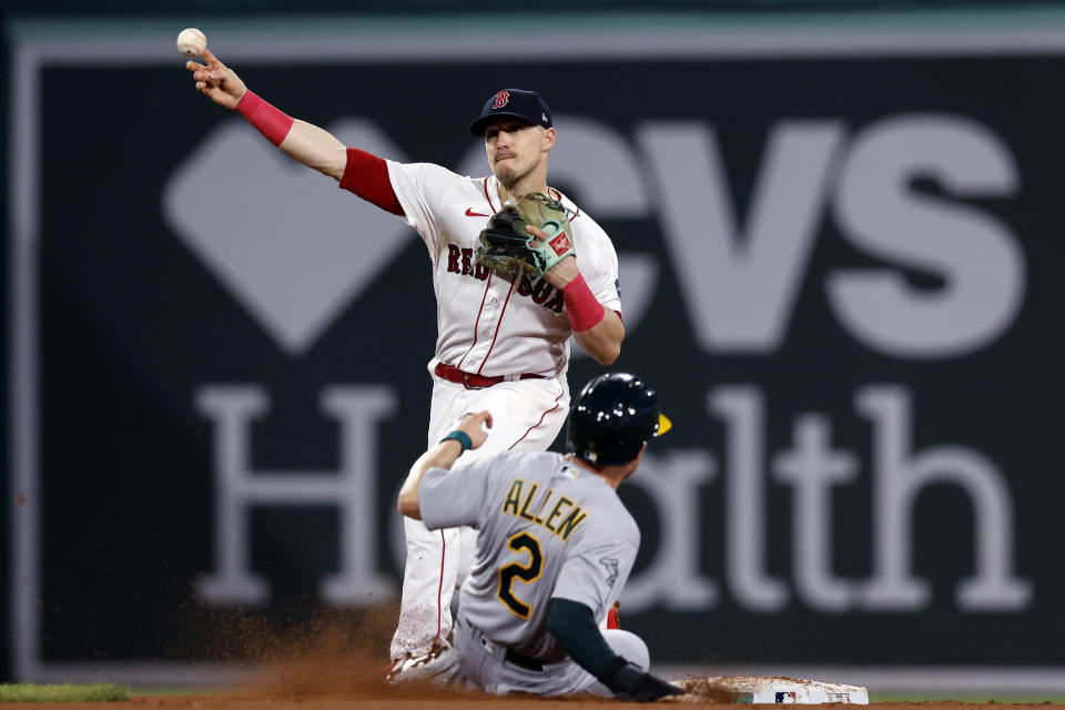 Oakland Athletics' Nick Allen (2) is forced out at second base as Boston Red Sox's Enrique Hernandez turns a double play on Shea Langeliers to end the baseball game Friday, July 7, 2023, in Boston. (AP Photo/Michael Dwyer)