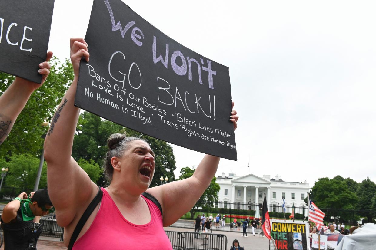 An abortion rights activist shouts during a demonstration in front of the White House in Washington, DC on July 09, 2022.