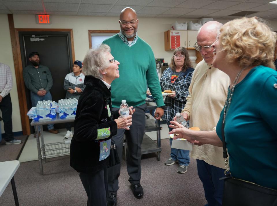 Diogenes Ayala comforts members of the Winterset community during a remembrance service for the devastating March 5, 2022, tornado at the New Bridge Church on Sunday, March 5, 2023, in Winterset, Iowa.