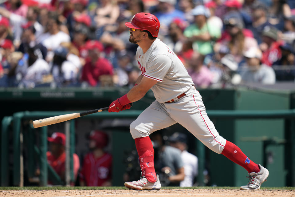 Philadelphia Phillies' Kyle Schwarber watches his three-run home run in the sixth inning of a baseball game against the Washington Nationals, Sunday, June 4, 2023, in Washington. (AP Photo/Patrick Semansky)