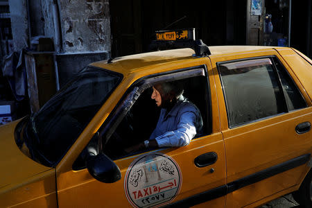 A taxi driver waits for customers in the Old City of Damascus, Syria, September 17, 2018. REUTERS/Marko Djurica