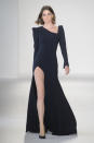 <p><i>Model wears a sleek black gown with pointed shoulders and a high slit from the SS18 Christian Siriano collection. (Photo: ImaxTree) </i></p>