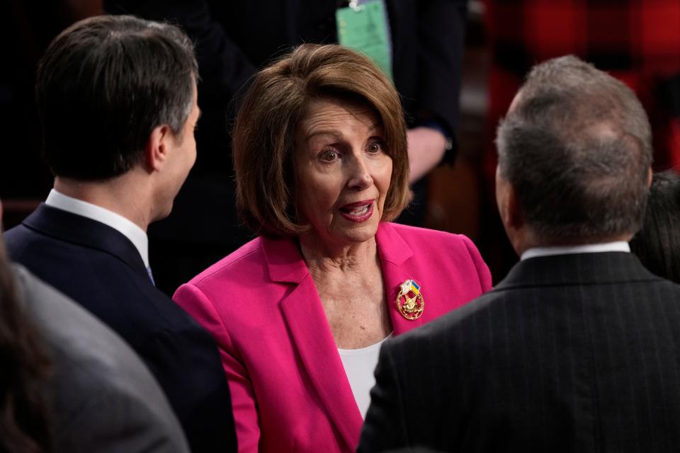 Feb 7, 2023; Washington, DC, USA; Former Speaker of the House, Nancy Pelosi (D-Calif.) speaks to lawmakers on the floor before President Joe Biden during the State of the Union address from the House chamber of the United States Capitol in Washington