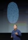 Phil Schiller, senior vice president of worldwide marketing for Apple Inc, talks about the new iPhone 5S Touch ID fingerprint recognition feature at Apple Inc's media event in Cupertino, California September 10, 2013. REUTERS/Stephen Lam (UNITED STATES - Tags: BUSINESS SCIENCE TECHNOLOGY BUSINESS TELECOMS)