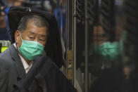 FILE - In this Feb. 1, 2021, file photo, democracy advocate Jimmy Lai leaves Hong Kong's Court of Final Appeal where the government is arguing against allowing him bail in Hong Kong. The Hong Kong stock exchange on Monday, May 17, 2021, halted the trading of Next Digital shares, days after authorities froze assets belonging to its founder Jimmy Lai.(AP Photo/Vincent Yu, File)