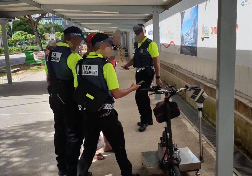 LTA officers catching an errant e-scooter rider on 1 January 2020, the first day of strict enforcement. (PHOTO: Land Transport Authority)