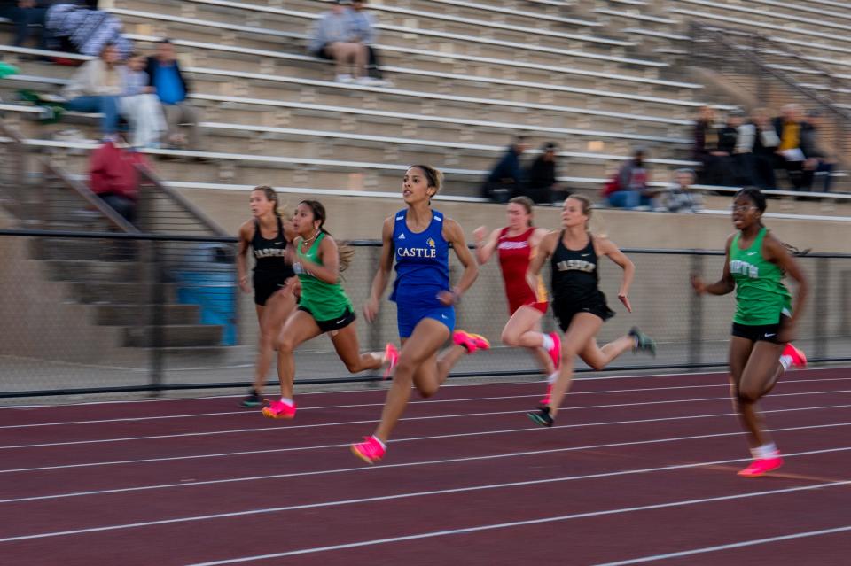 Castle’s Amaya Royal leads in the 100 meter dash during the 2023 Southern Indiana Athletic Conference Girls Track & Field meet at Central High School in Evansville, Ind., Wednesday, May 3, 2023.