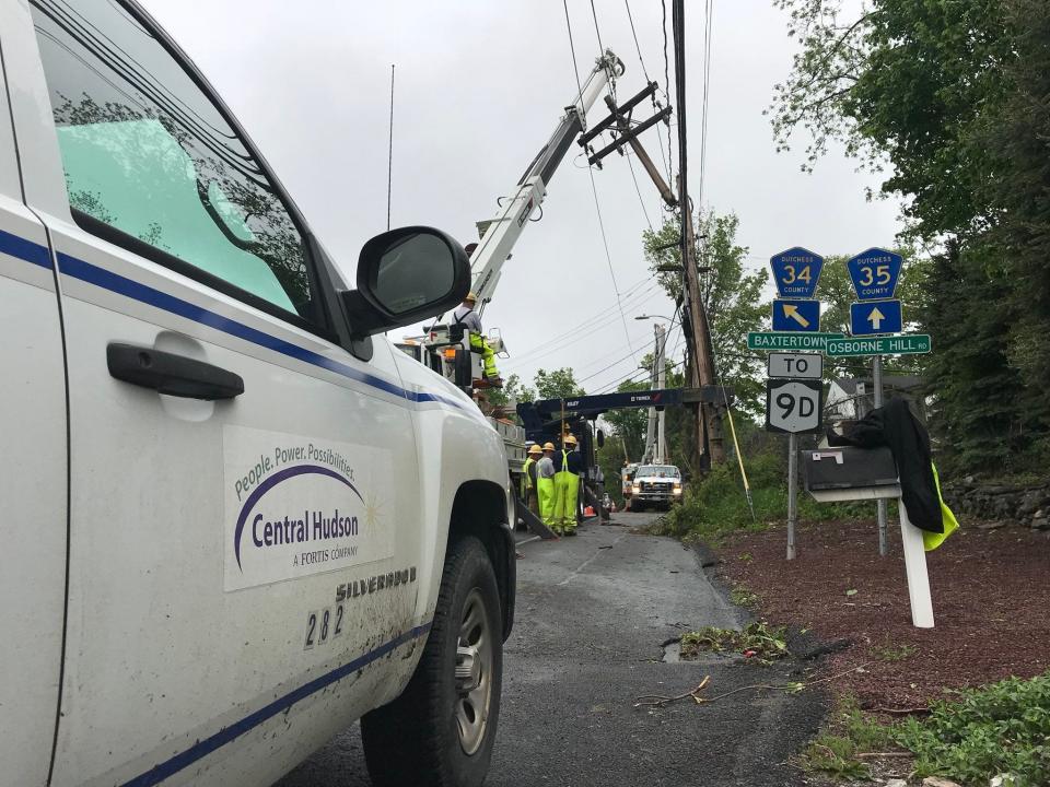 A Central Hudson Gas & Electric Corp. crew works to replace a utility pole at an intersection in Fishkill.