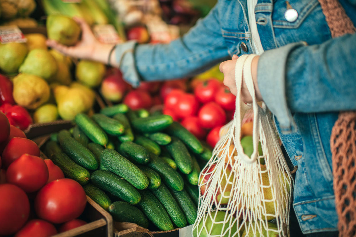 Vegetables and fruit in reusable bag on a farmers market Getty Images/ArtMarie
