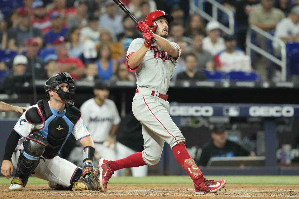 Philadelphia Phillies' Johan Rojas hits a double during the third inning of a baseball game against the Miami Marlins, Wednesday, Aug. 2, 2023, in Miami. (AP Photo/Marta Lavandier)