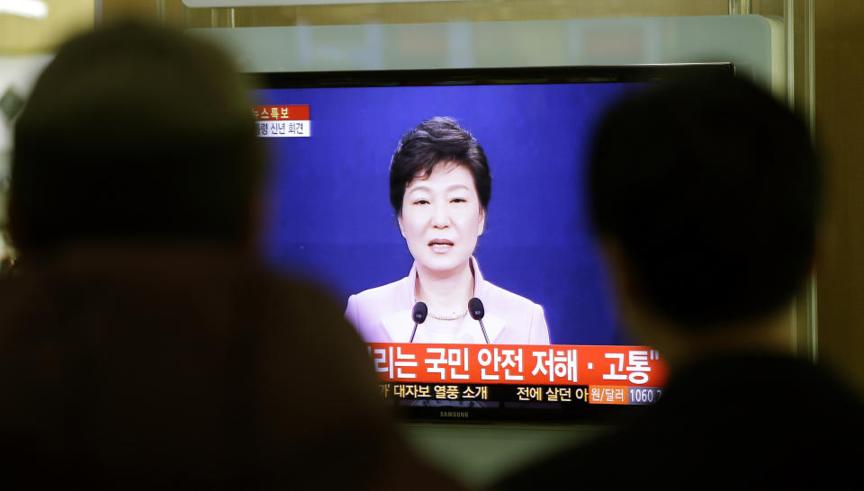 People watch a television program airing South Korean President Park Geun-hye's New Year's speech to the nation, at the Seoul Train Station in Seoul, South Korea, Monday, Jan. 6, 2014. Park called on Monday for resuming reunions of families separated by war, saying it was a chance to improve strained ties between the rival Koreas. (AP Photo/Lee Jin-man)