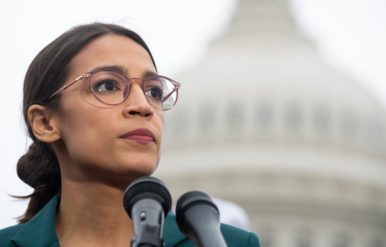 <p> In this file photo taken on 7 February 2019, US representative Alexandria Ocasio-Cortez, Democrat of New York, speaks during a press conference to announce Green New Deal legislation to promote clean energy programs outside the US Capitol in Washington, DC</p> ((AFP via Getty Images))