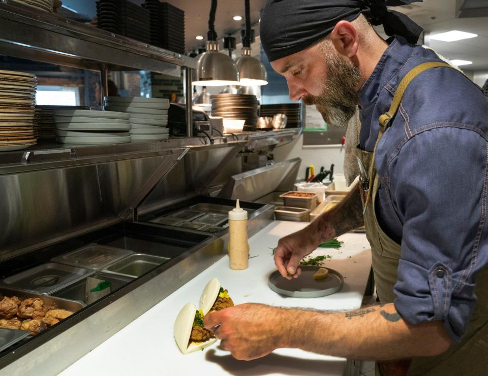 Executive chef and owner Aaron Cozadd of Vigilante Kitchen plates Szechuan Hot Chicken on Thursday, June 29, 2023. The restaurant officially opened on June 30, 2023.