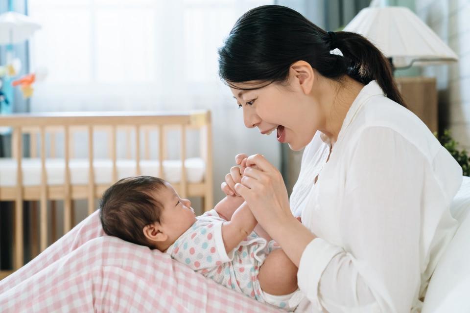 Engaging an infant in conversation or song (even a pre-verbal infant) is a powerful way to encourage language learning. (Shutterstock)