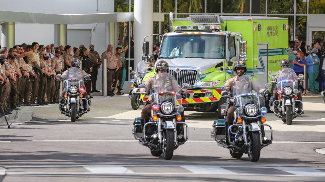 Police escort the body of Miami-Dade Police Detective Cesar Echaverry from Jackson Memorial Hospital to the Miami-Dade County Medical Examiner’s Department on Friday, Aug. 19, 2022. Echaverry succumbed to his injuries after being shot in the head in a shootout with an armed robbery suspect. He died Wednesday night when doctors removed the ventilator that had been keeping him alive in Miami.