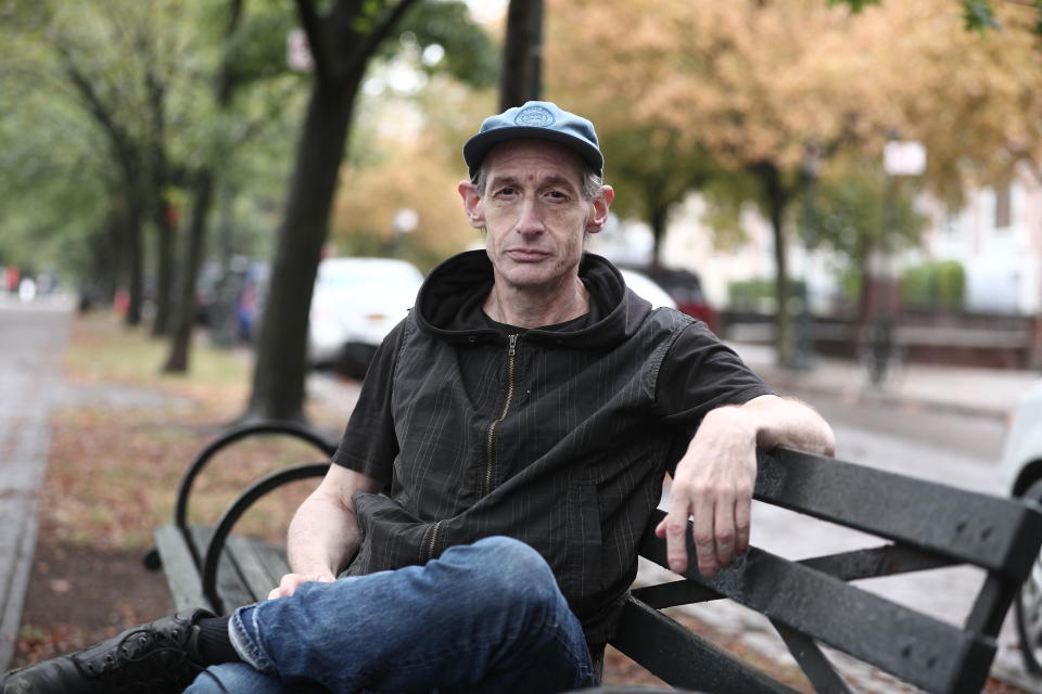 Former college music professor David Shohl sits on a park bench along the Eastern Parkway in the Crown Heights section of Brooklyn. (Photo: Gordon Donovan/Yahoo News)