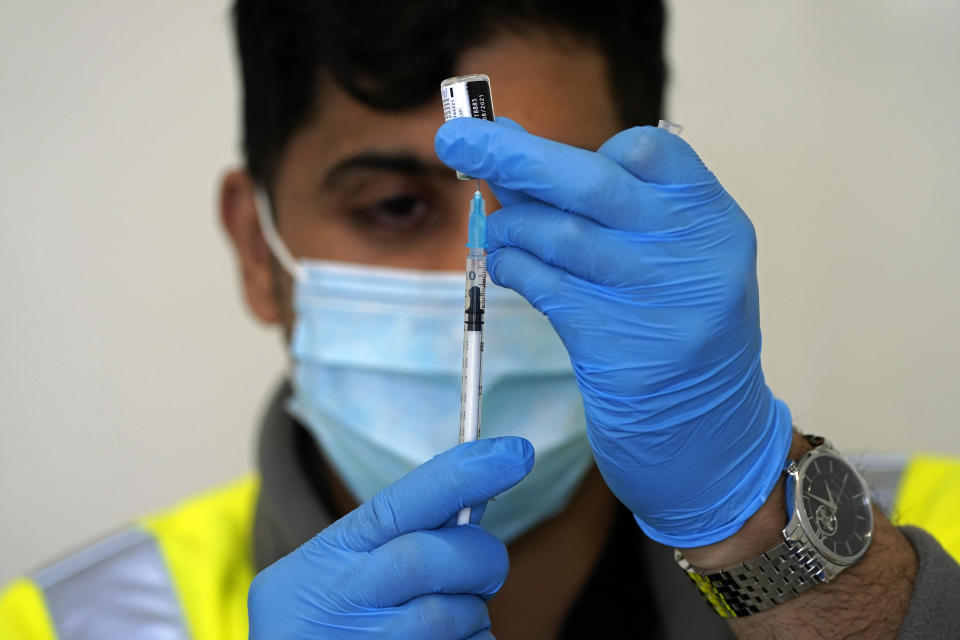 Thamoor Faqir prepares to give a Covid-19 vaccination at the Penny Street vaccination centre in Blackburn as the spread of the Indian coronavirus variant could lead to the return of local lockdowns, ministers have acknowledged. Bolton, Blackburn with Darwen and Bedford, are the areas ministers are most concerned about. Picture date: Tuesday May 18, 2021.