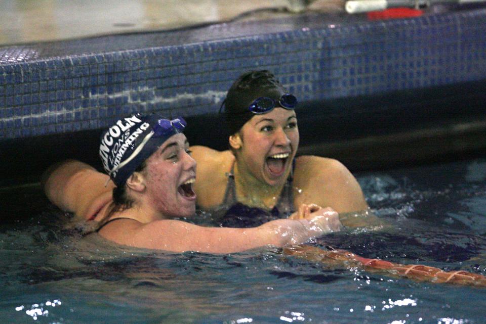 Elizabeth Beisel, right, reacts after learning that she set a new state and national record in the 100-yard backstroke during the girls high school swimming state championships in 2008. At left is Ariel Bender of Lincoln.