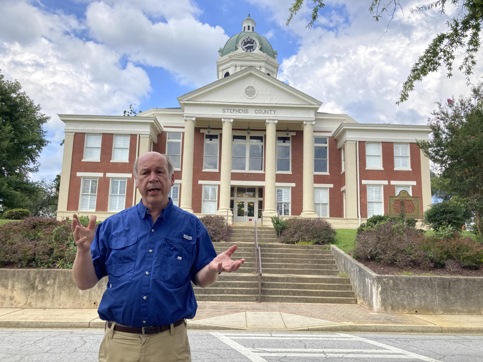 Stephens County Democratic Committee Chair Mike Maley talks about efforts to rebuild Democratic Party strength in his area on Friday, Sept. 2, 2022 in front of the Stephens County Courthouse in Toccoa, Ga. Republicans in Georgia increasingly rely on voters in north Georgia as their margins shrink in suburban Atlanta. (AP Photo/Jeff Amy)