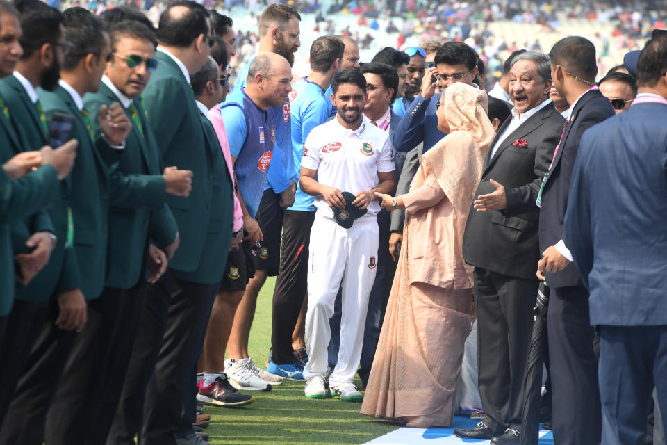 Bangladesh's Prime Minister Sheikh Hasina (4th R) speaks with Bangladesh's cricket team captain Mominul Haque (C) before the start of the first day of the second Test cricket match of a two-match series between India and Bangladesh at The Eden Gardens cricket stadium in Kolkata on November 22, 2019. (Photo by Dibyangshu SARKAR / AFP) / IMAGE RESTRICTED TO EDITORIAL USE - STRICTLY NO COMMERCIAL USE