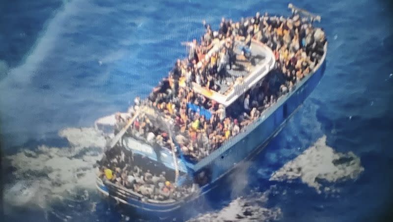 This undated handout image provided by Greece’s coast guard on Wednesday, June 14, 2023, shows scores of people covering practically every free stretch of the deck on a battered fishing boat that later capsized and sank off southern Greece. A fishing boat carrying migrants trying to reach Europe capsized and sank off Greece on Wednesday, authorities said, leaving at least 79 dead and many more missing in one of the worst disasters of its kind this year.