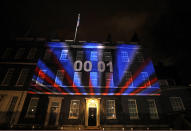 FILE - In this Friday, Jan. 31, 2020 file photo a countdown to Brexit timer and the colors of the British Union flag illuminate the exterior of 10 Downing street, the residence of the British Prime Minister, in London, England. (AP Photo/Kirsty Wigglesworth, File)