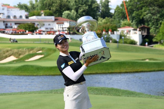 South Korea's In Gee Chun poses with the trophy after winning the KPMG Women’s PGA Championship at Congressional Country Club. (Nick Wass/AP).