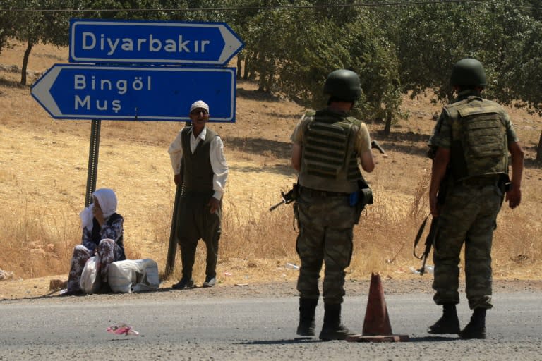 Turkish soldiers wait at a check point in Diyarbakir on July 26, 2015