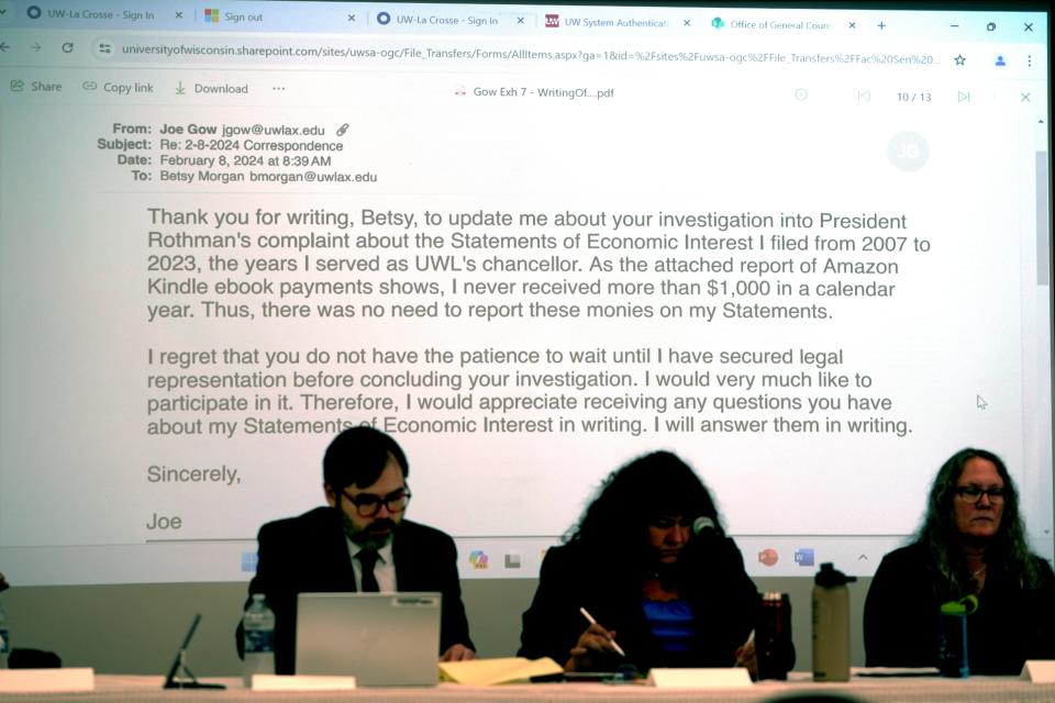 Fired UW-La Crosse Chancellor Joe Gow presents an email he sent to interim Chancellor Betsy Morgan during a disciplinary hearing to decide whether he should be fired as a faculty member from the University of Wisconsin-La Crosse Thursday in Onalaska.