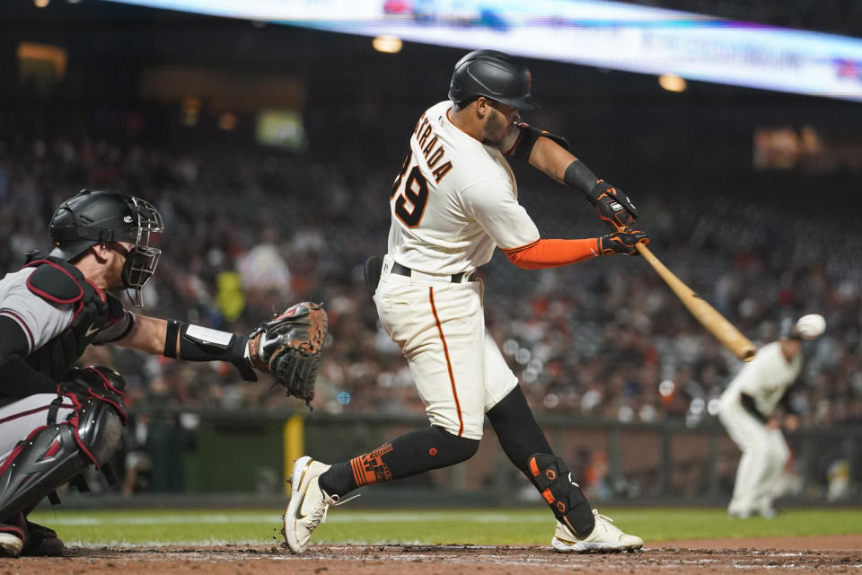 San Francisco Giants' Thairo Estrada hits an RBI double against the Arizona Diamondbacks during the sixth inning of a baseball game in San Francisco, Monday, Aug. 15, 2022. (AP Photo/Godofredo A. Vásquez)