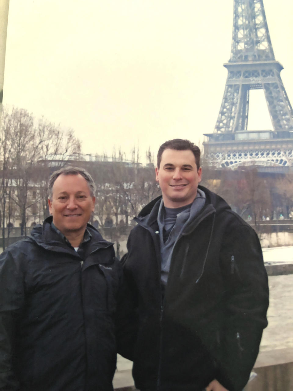 This undated photo made available by the Modell family, shows Ryan Modell, right, as he visits Paris with his father Sandy Modell. Sandy Modell is asking Florida Gov. Ron DeSantis to reopen the investigation into his son's 2016 shooting death during an altercation at Ryan's Fort Myers, Fla., condominium complex. Local prosecutors declined to charge the shooter, Steve Taylor, citing the state's "stand your ground" law, a decision Sandy Modell wants reversed. (Modell family via AP)