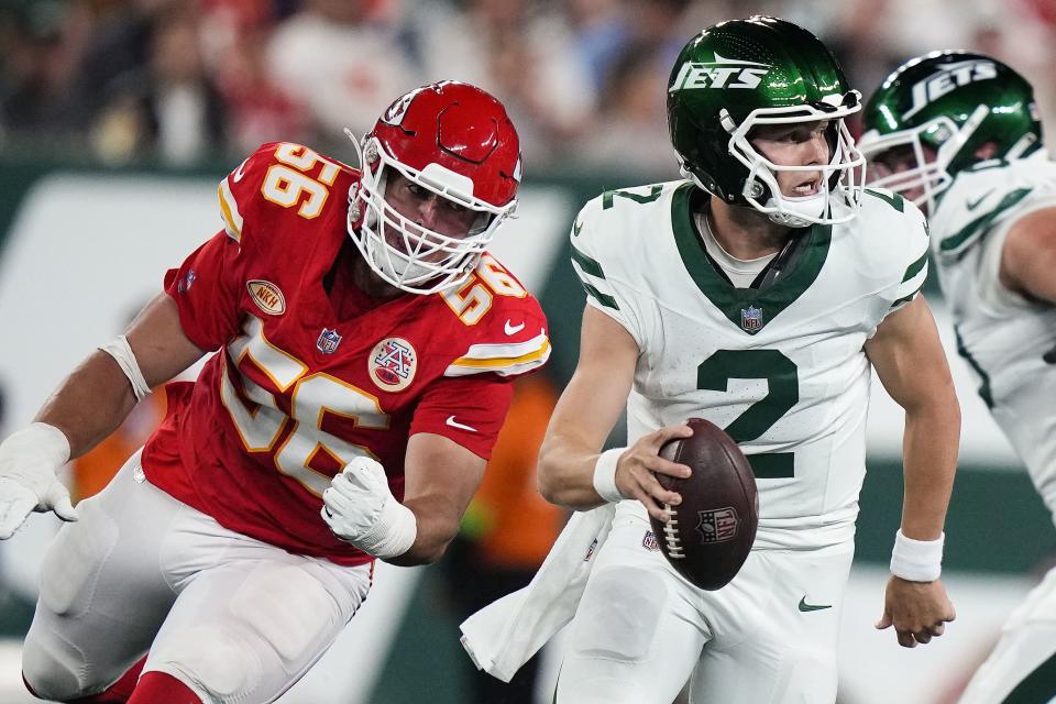 New York Jets quarterback Zach Wilson looks to pass as Kansas City Chiefs defensive end George Karlaftis puts the pressure on during game, Sunday, Oct. 1, 2023, in East Rutherford, N.J. | Frank Franklin II, Associated Press