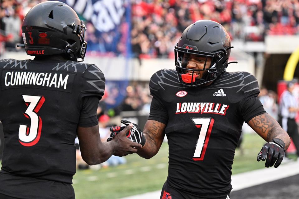 Oct 29, 2022; Louisville, Kentucky, USA;  Louisville Cardinals running back Tiyon Evans (7) celebrates with quarterback Malik Cunningham (3) after scoring a touchdown against the Wake Forest Demon Deacons during the second half at Cardinal Stadium. Louisville won 48-21. Mandatory Credit: Jamie Rhodes-USA TODAY Sports