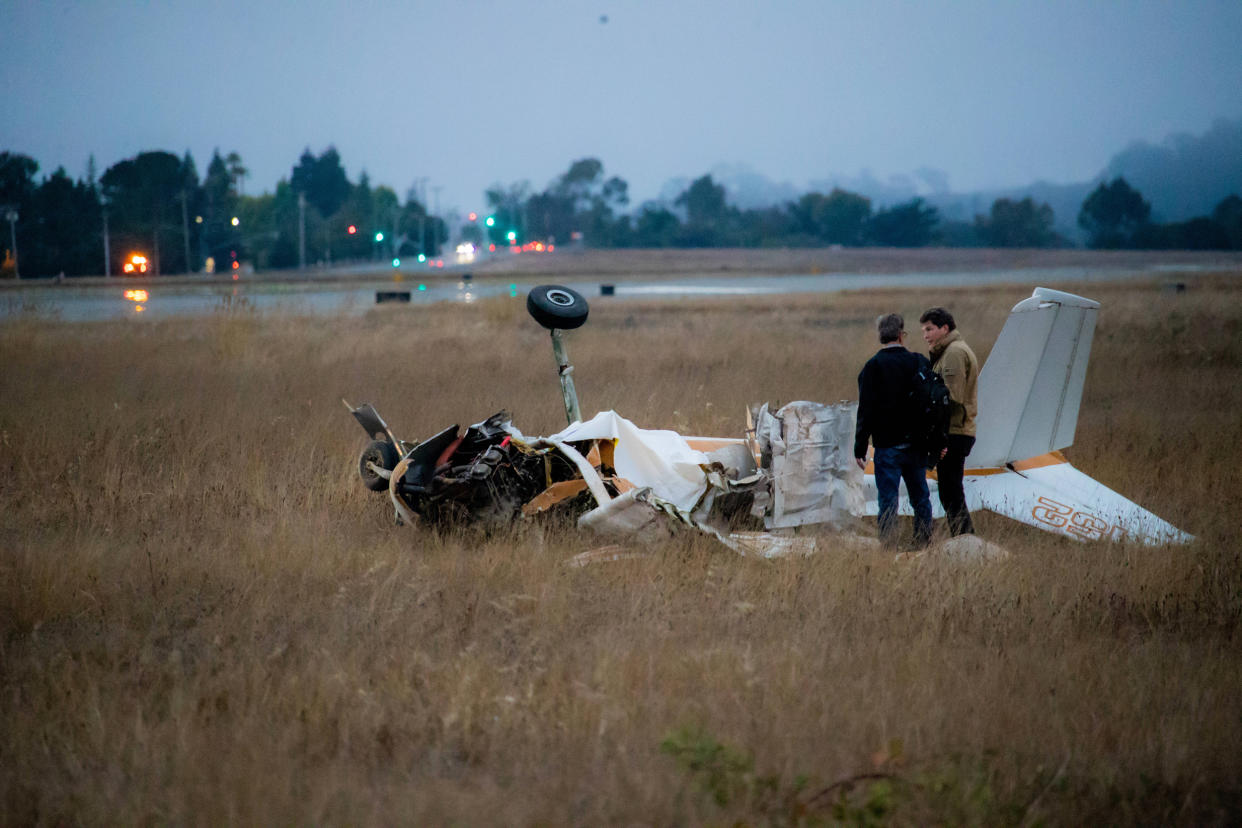 Investigators work at the crash site after two planes collided in Watsonville, Calif., on Aug. 18, 2022. (Chine Nouvelle / SIPA / Shutterstock)