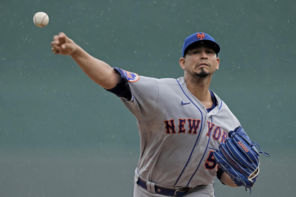 New York Mets starting pitcher Carlos Carrasco throws during the first inning of a baseball game against the Kansas City Royals Thursday, Aug. 3, 2023, in Kansas City, Mo. (AP Photo/Charlie Riedel)