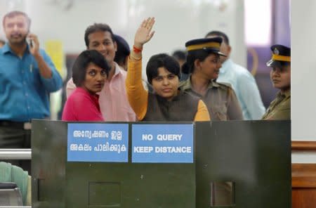 Trupti Desai, a women's rights activist, waves from inside the Cochin International Airport at Kochi, India, November 16, 2018. REUTERS /Sivaram V