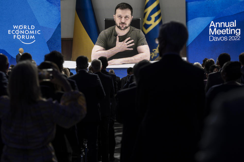 FILE - Ukrainian President Volodymyr Zelenskyy addresses by videolink the opening plenary session hosted by Klaus Schwab, Founder and Executive Chairman, World Economic Forum, left, during the 51st annual meeting of the World Economic Forum, WEF, in Davos, Switzerland, on Monday, May 23, 2022. As Russia’s invasion of Ukraine grinds into its fourth month, officials in Kyiv have expressed fears that the specter of “war fatigue” could erode the West’s resolve in helping the country push back Moscow’s aggression. (Laurent Gillieron /Keystone via AP, File)