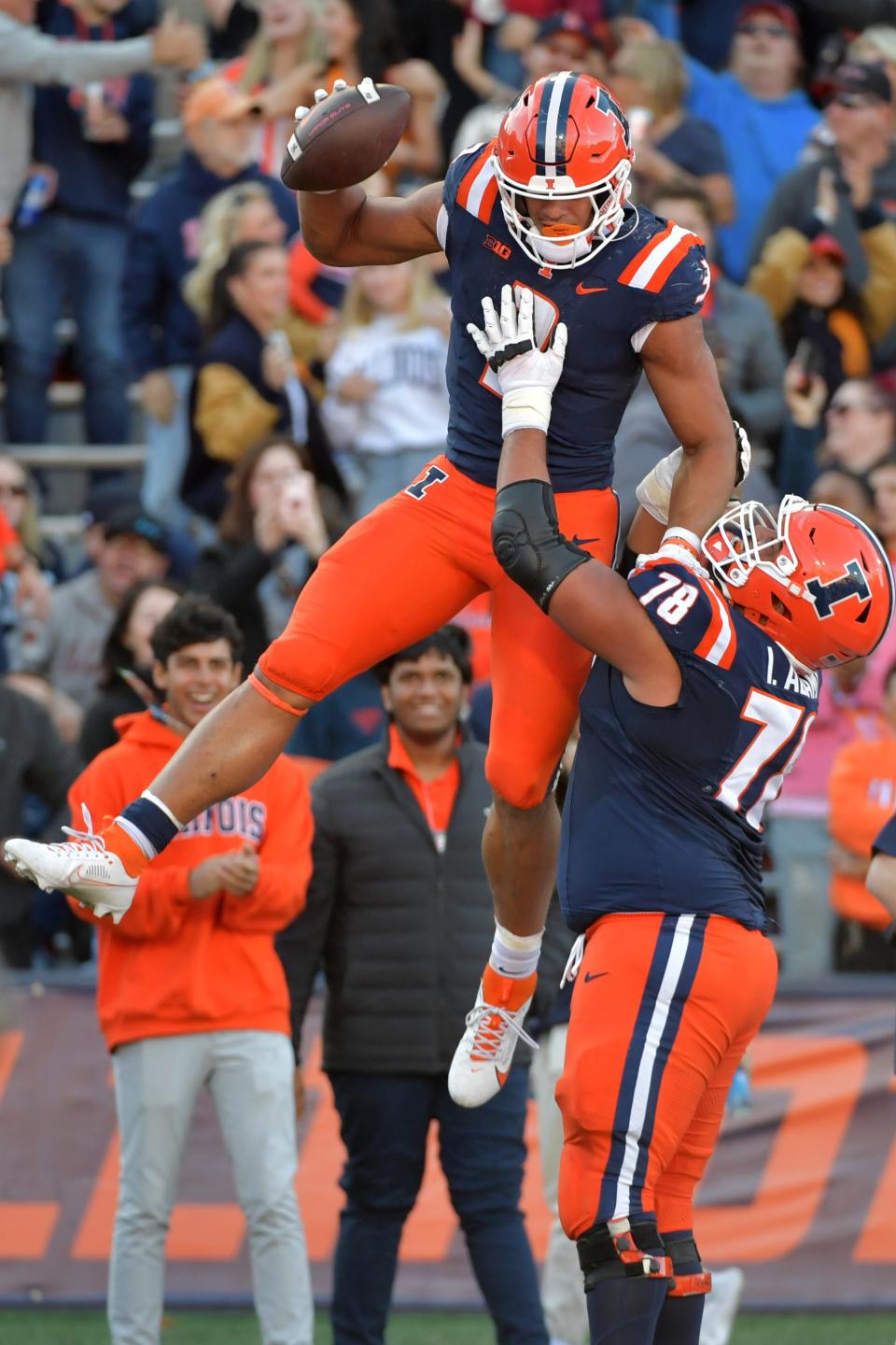 Oct 21, 2023; Champaign, Illinois, USA; Illinois Fighting Illini running back Kaden Feagin (3) is lifted up by teammate Isaiah Adams (78) during the second half at Memorial Stadium. Mandatory Credit: Ron Johnson-USA TODAY Sports