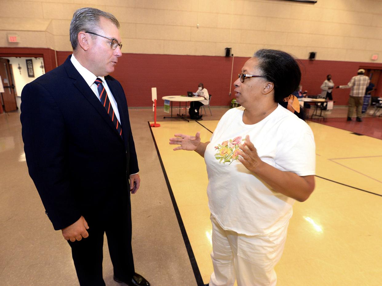 Sagamon County Clerk Don Gray, left, talks with one of his election Judges, Angela Harris, at the opening of the polls at the Union Baptist Church Tuesday June 28, 2022.