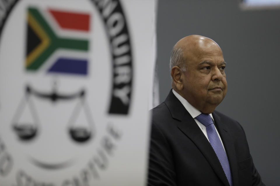 Public Enterprises Minister Pravin Gordhan appears at the judicial commission of inquiry into state capture in Johannesburg, South Africa. Monday, Nov. 19, 2018. Gordhan is expected to reveal details surrounding former president Jacob Zuma's trillion-rand nuclear procurement campaign as well as other corruption prcatices. (AP Photo/Themba Hadebe)