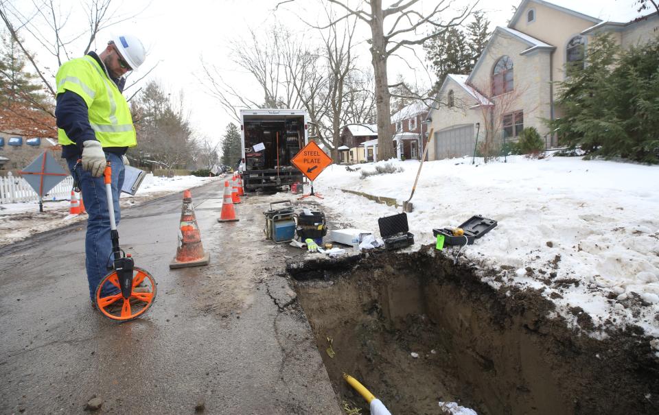 Mark Chronaberry, construction coordinator for Columbia Gas of Ohio, takes some measurements on Royal Forest Boulevard on Jan. 19 where crews are installing new lines.