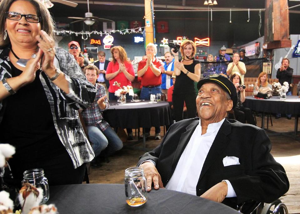 FILE - In this Oct. 16, 2012, file photo, Bobby “Blue” Bland, center, is honored with a standing ovation as he is named as an inductee to the Memphis Music Hall of Fame during a ceremony at The Warehouse in Memphis, Tenn. Bland's son Rodd said his father died Sunday, June 23, 2013, at his Memphis home surrounded by relatives. He was 83. (AP Photo/The Commercial Appeal, Nikki Boertman)