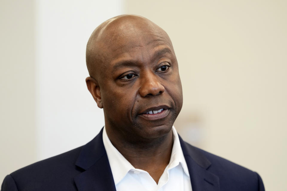 Sen. Tim Scott, R-S.C., tours the Marion Public Library, Wednesday, April 12, 2023, in Marion, Iowa. Scott on Wednesday launched an exploratory committee for a 2024 GOP presidential bid, a step that comes just shy of making his campaign official. (AP Photo/Charlie Neibergall)