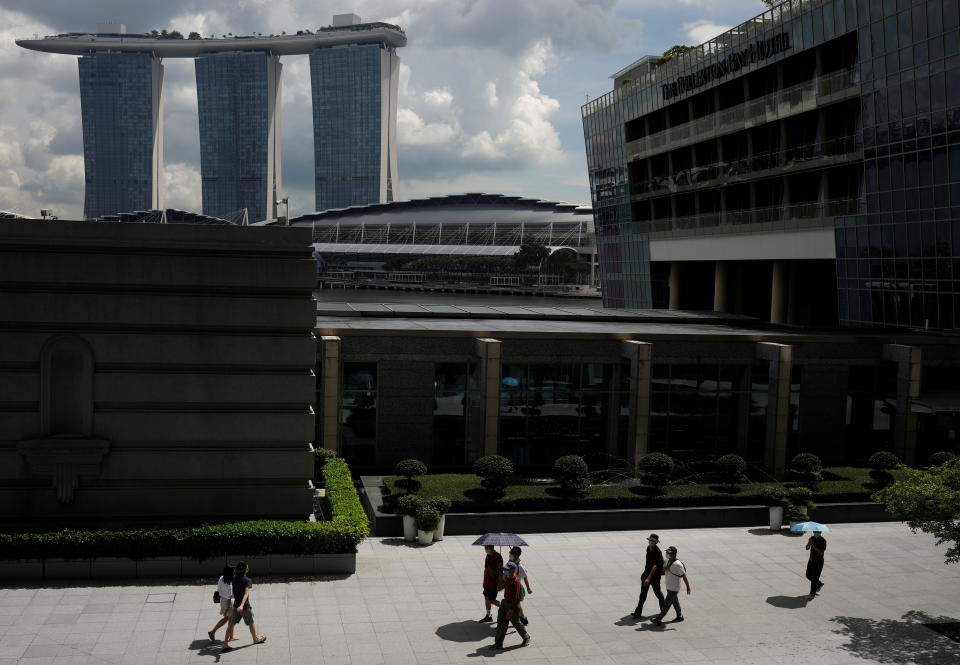 People walking at the central business district in Singapore. 