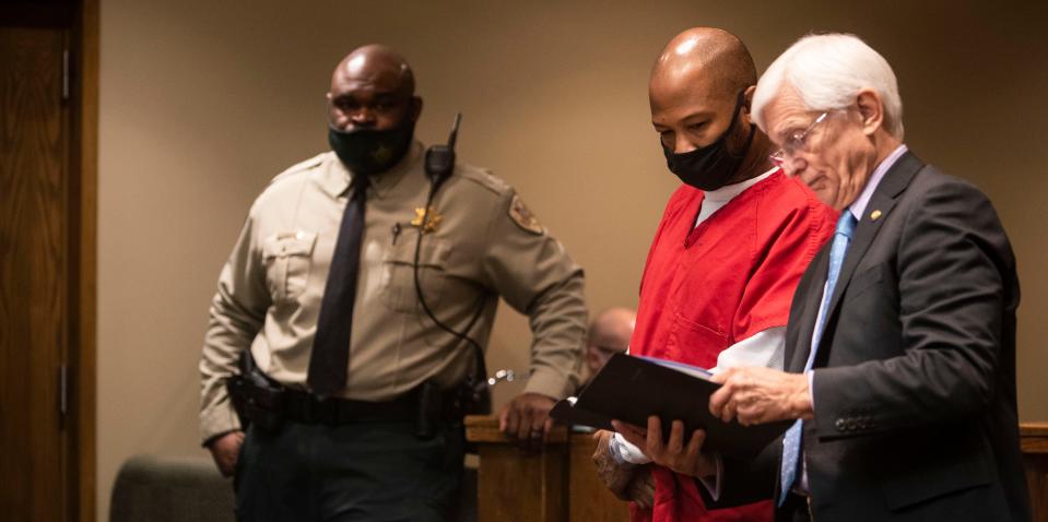 Hernadez Govan, the third man accused of murdering Young Dolph, reads a document with his lawyer, William Massey at his hearing at Shelby County Criminal Justice Center on Nov. 17, 2022 in Memphis, TN.