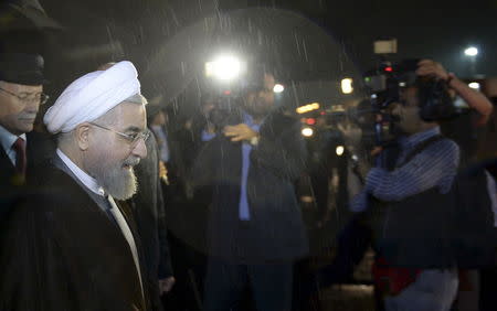 Iran's President Hassan Rouhani (L) attends a welcoming ceremony upon his arrival in Ufa, Russia, the early hours of July 9, 2015. REUTERS/BRICS/SCO Photohost/RIA Novosti