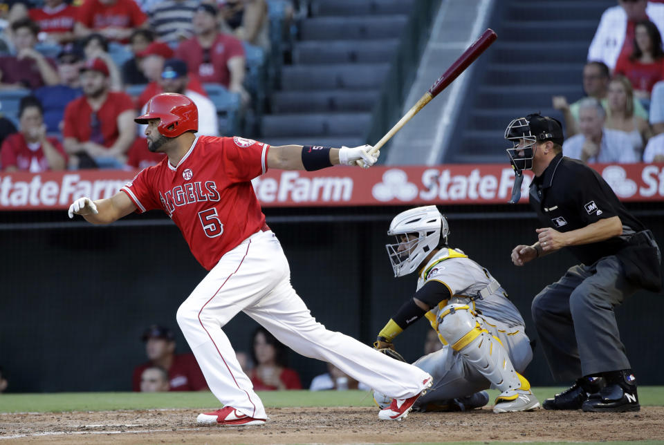 Los Angeles Angels' Albert Pujols drives in a run with a single against the Pittsburgh Pirates during the fourth inning of a baseball game Wednesday, Aug. 14, 2019, in Anaheim, Calif. (AP Photo/Marcio Jose Sanchez)